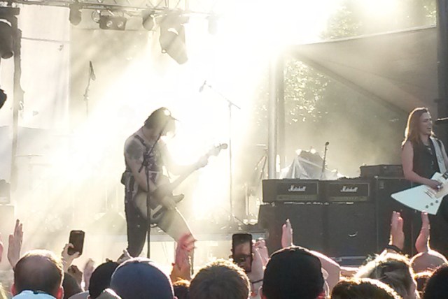 Halestorm performing last September. Not a great photo, but I like the way the sun came in behind the stage.